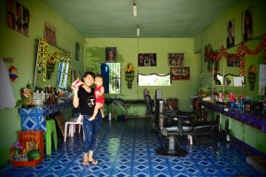 Colorful beauty salon with friendly owner and her son, Pakse
